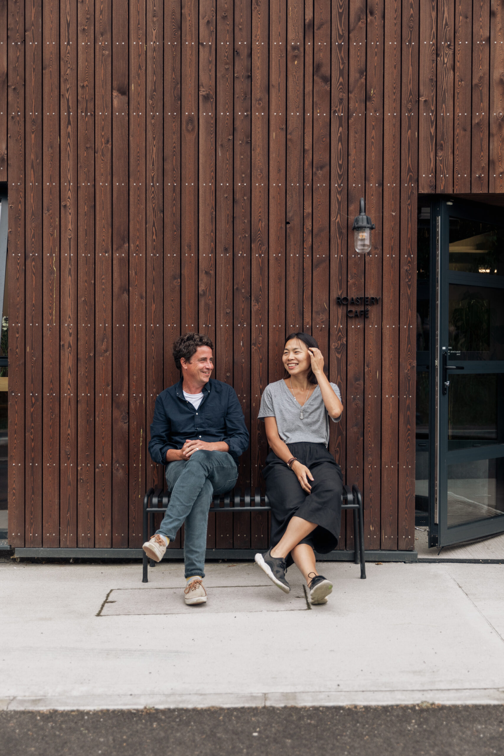 Origin Coffee owners outside one of their cafes.